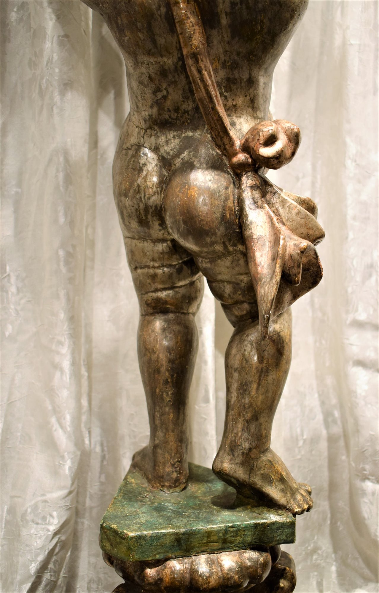 Wooden sculpture depicting a cherub holder